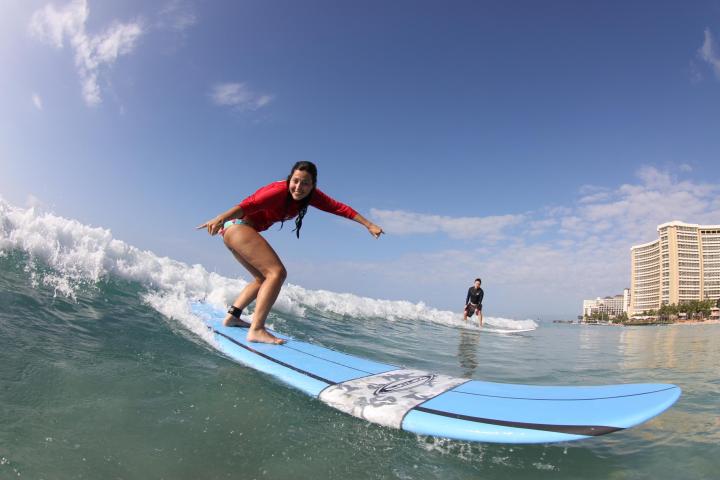 a man riding a wave on a surfboard in the water
