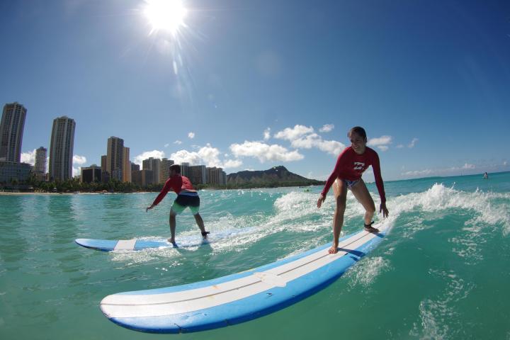 a man riding a wave on a surfboard in the water
